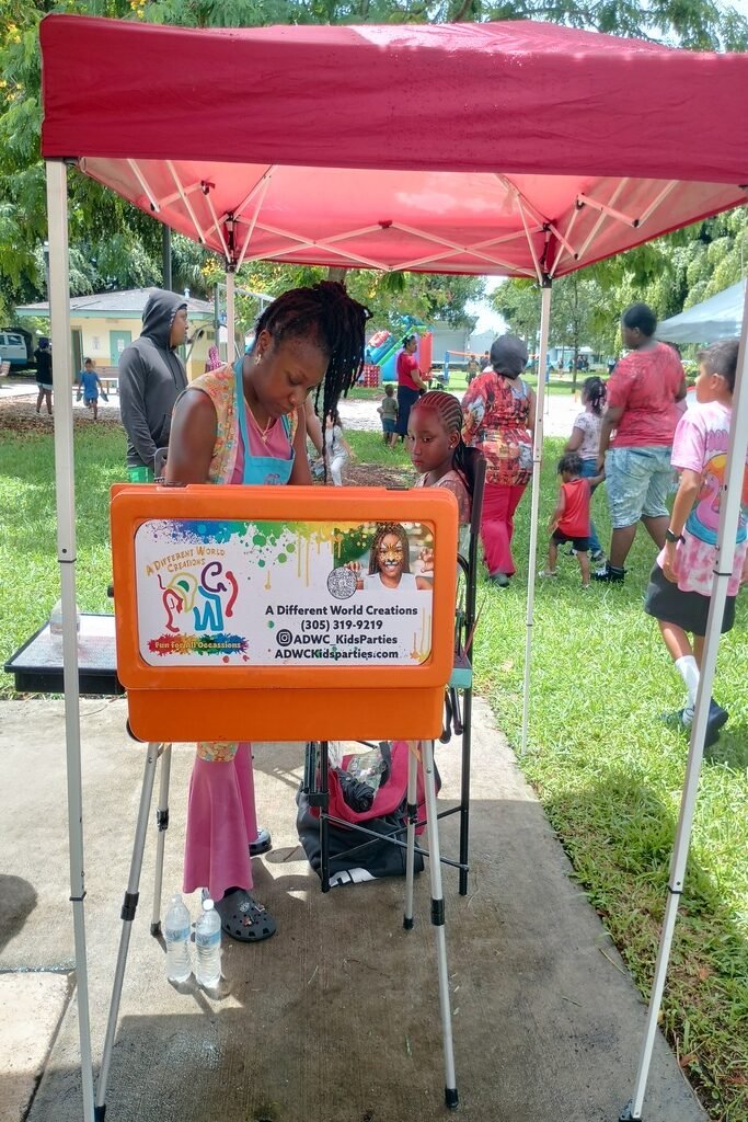 Ms.Tiffany Sanders painting faces 1 rotated