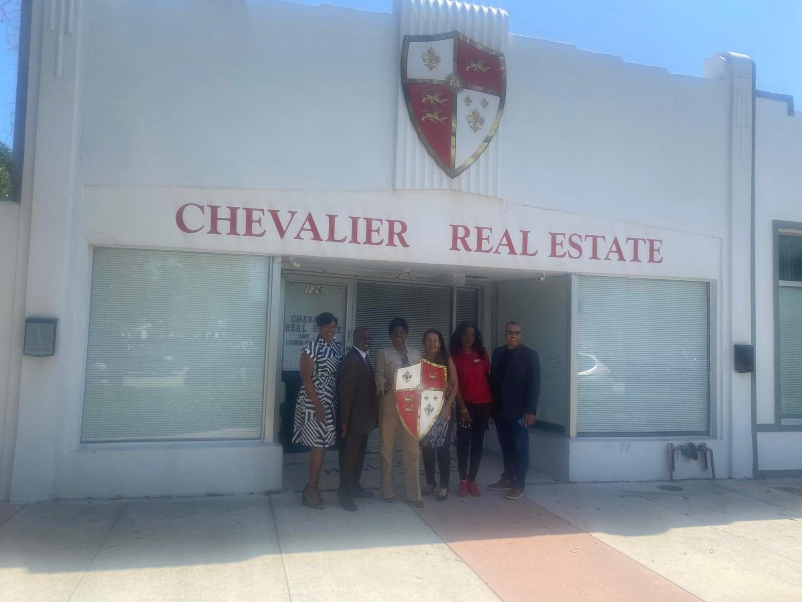 Agents outside Chevalier Real Estate scaled